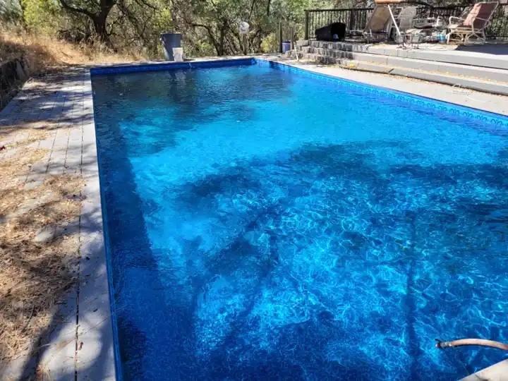 Clear blue pool after green-to-clean service by The Goods Pool Service